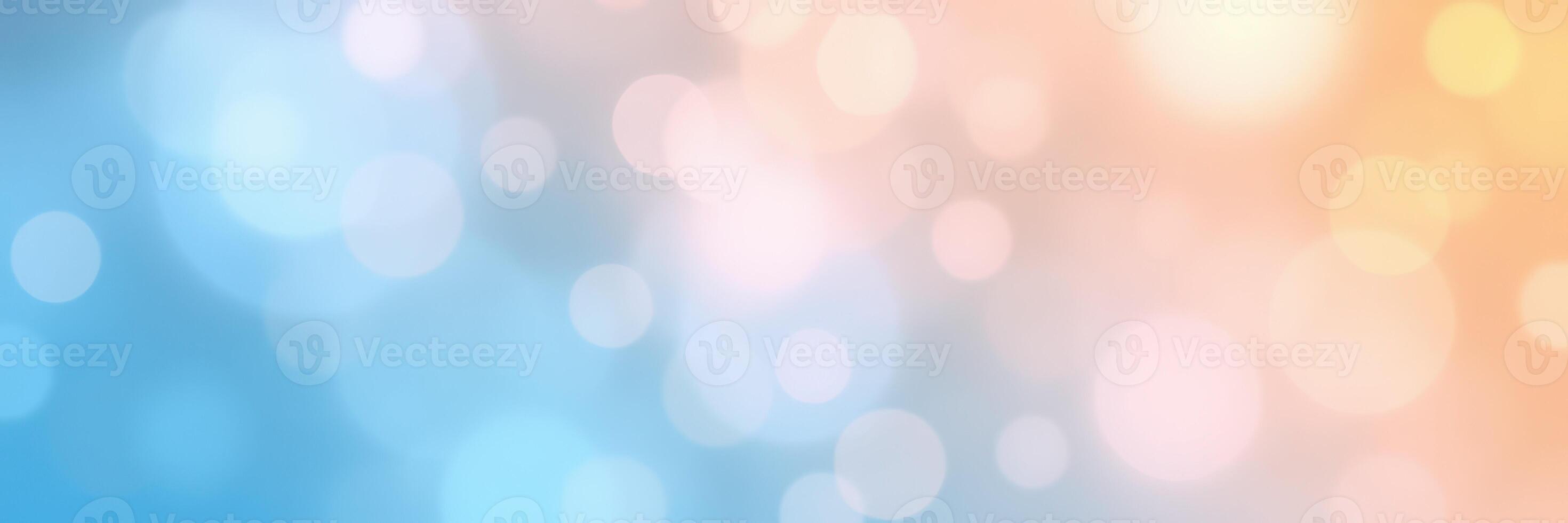 Soft bokeh background blending blue and peach hues with gentle light effects creating a serene atmosphere photo