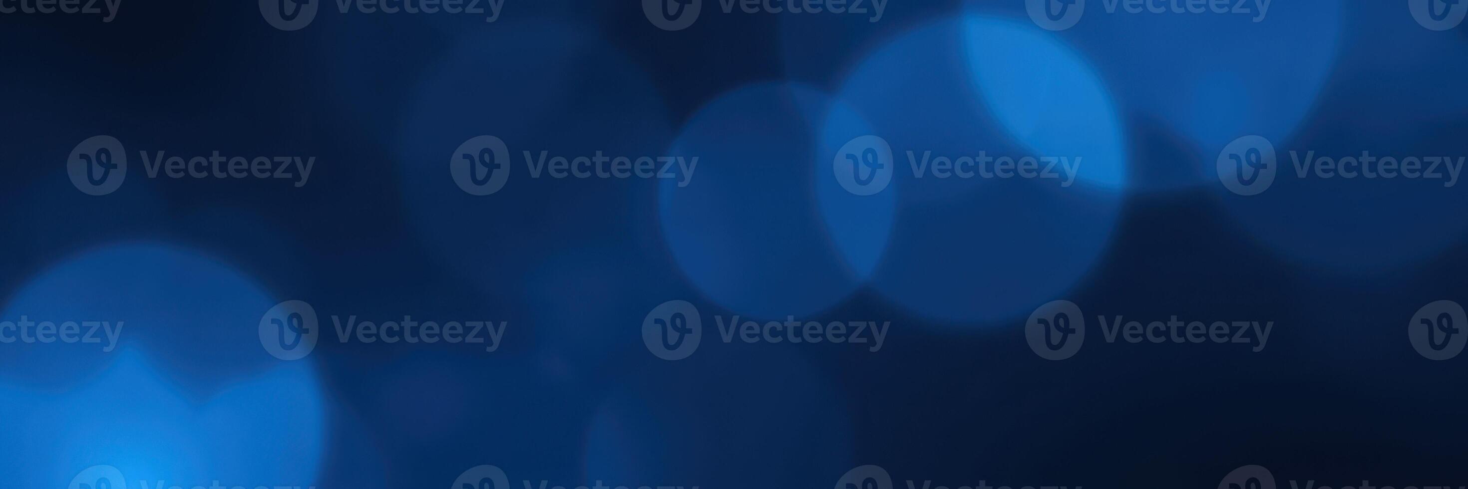 Soft blue bokeh lights create a calming atmosphere at night during a social gathering photo