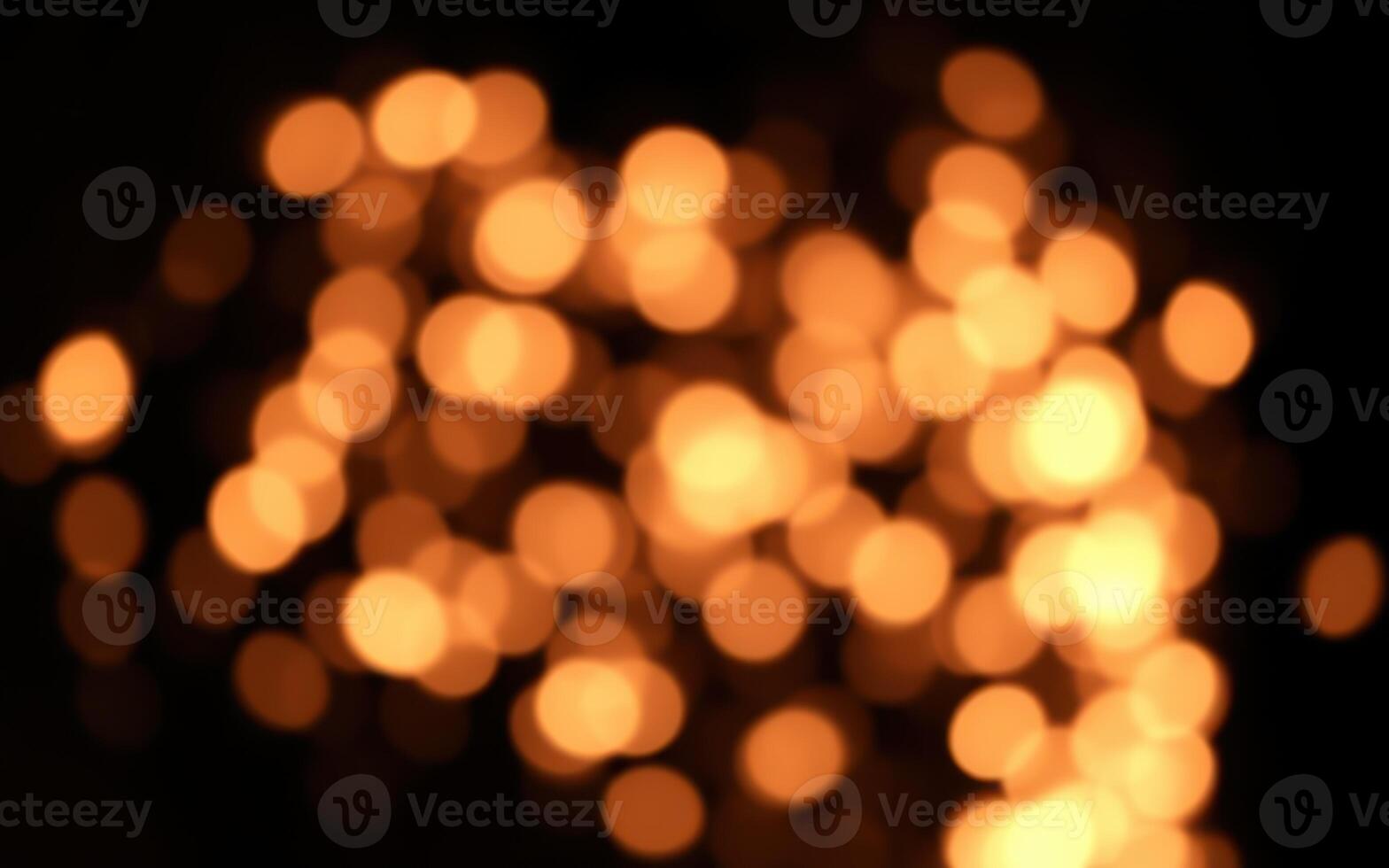 Warm golden bokeh lights create a cozy atmosphere suitable for gatherings and celebrations at night photo