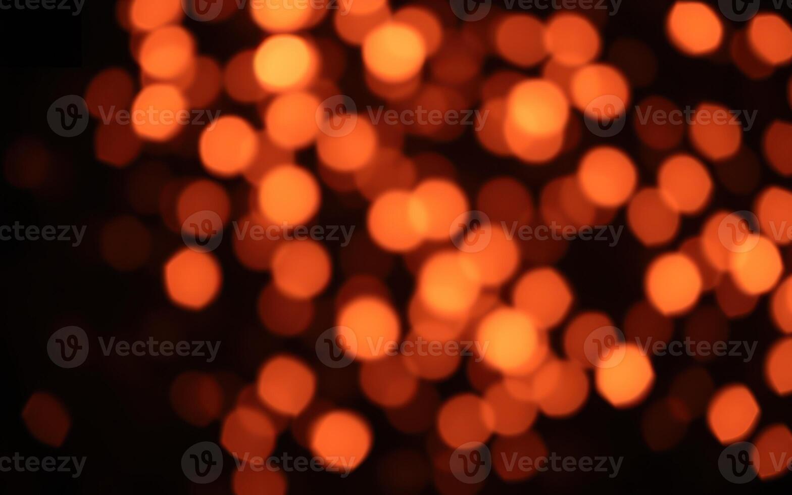 Warm glowing bokeh lights create a cozy atmosphere during a festive evening gathering photo