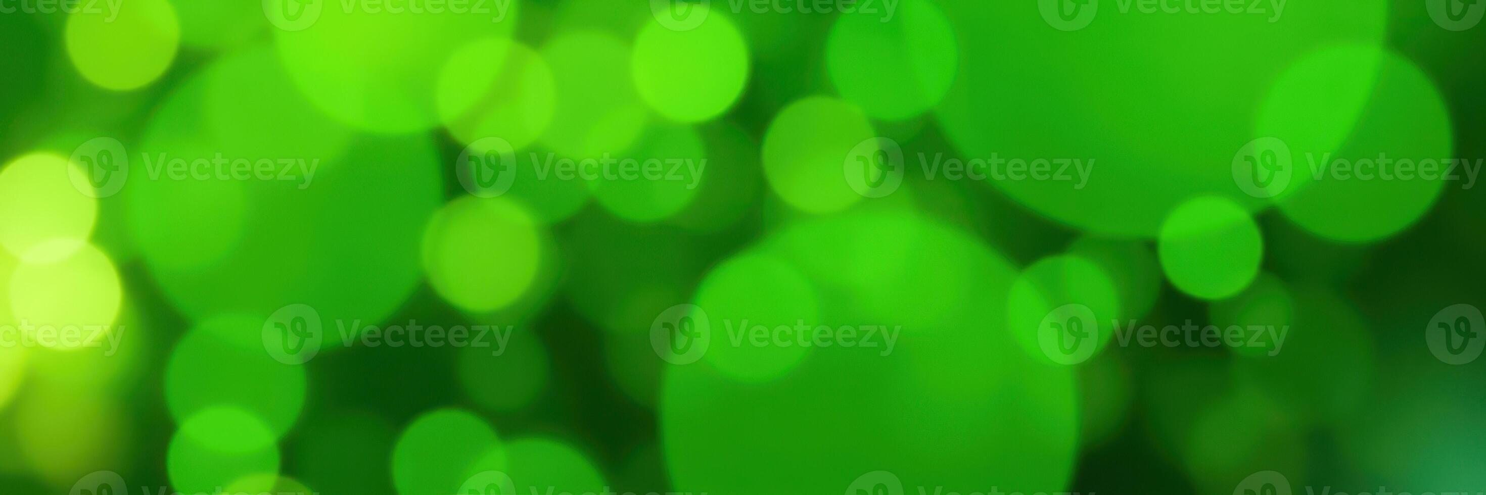 Vibrant green bokeh background creating a lively and refreshing atmosphere in a natural setting photo