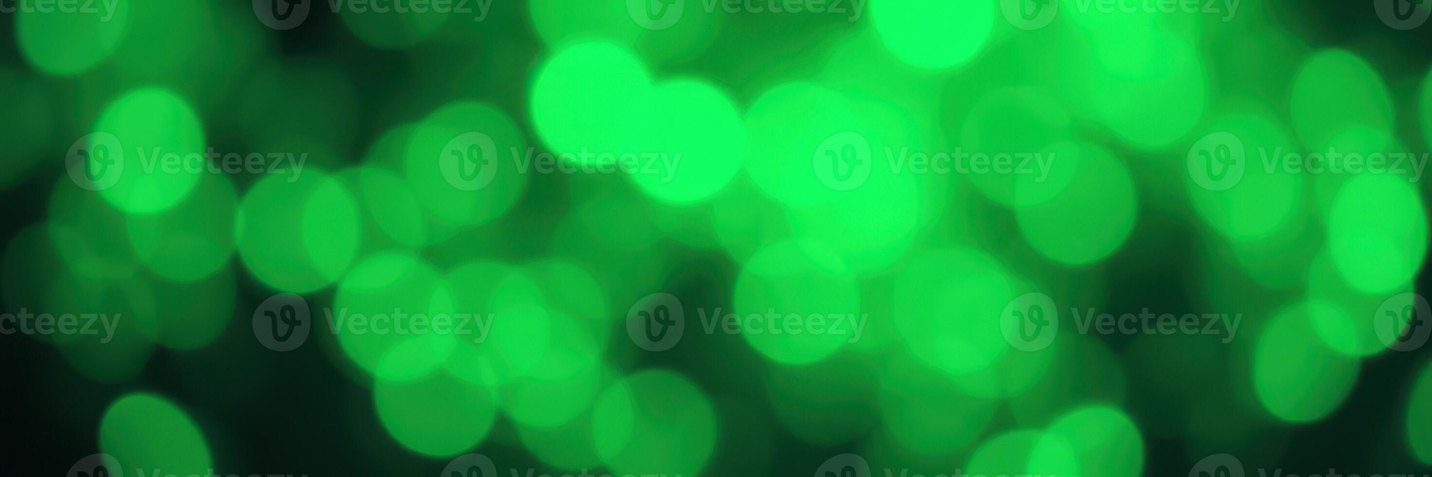Colorful green bokeh lights create a vibrant atmosphere during a festive celebration at night photo