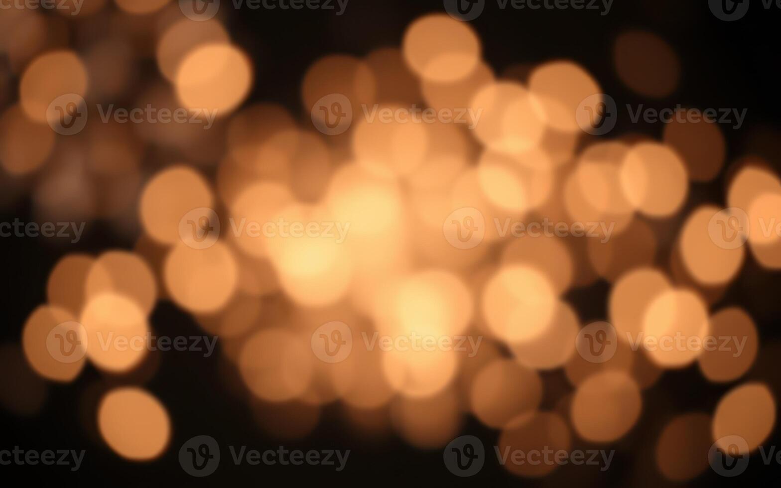 Warm golden bokeh lights create an enchanting atmosphere during a festive evening celebration photo