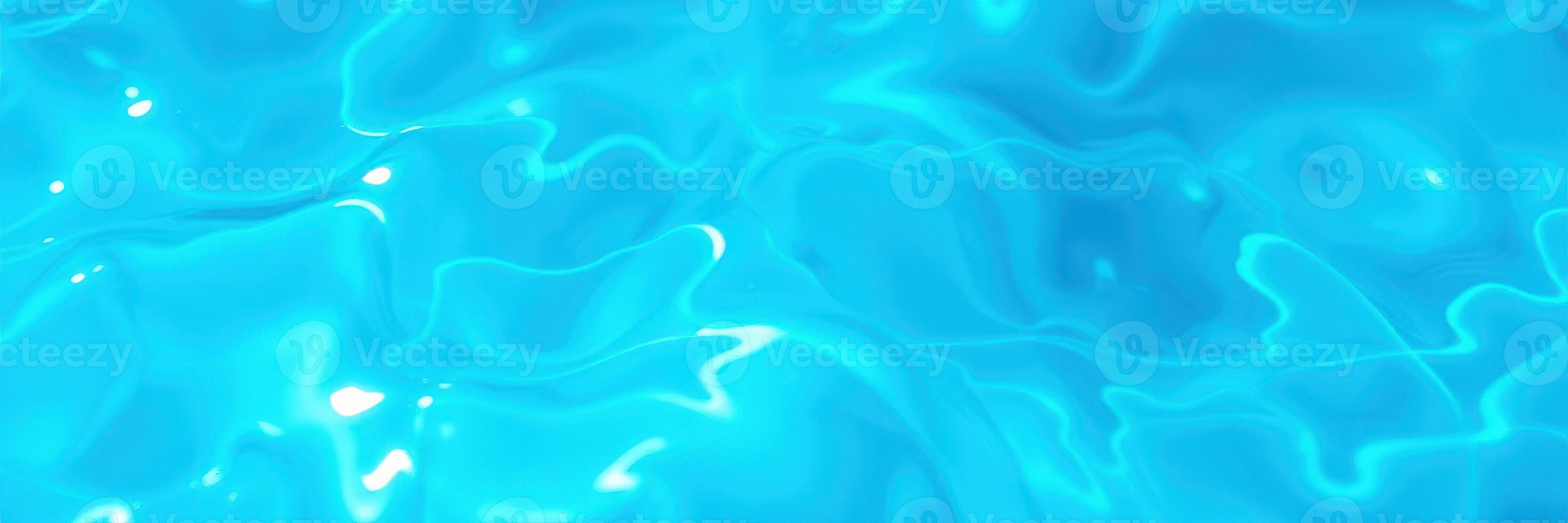 Captivating ripples in crystal clear water at a sunny pool in mid-afternoon reflecting light and creating mesmerizing patterns photo