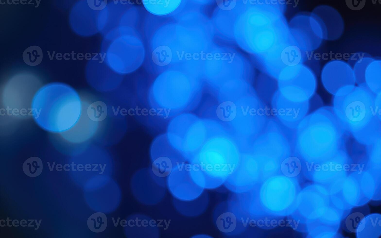 Illuminated blue bokeh lights create a dreamy atmosphere in a nighttime setting photo