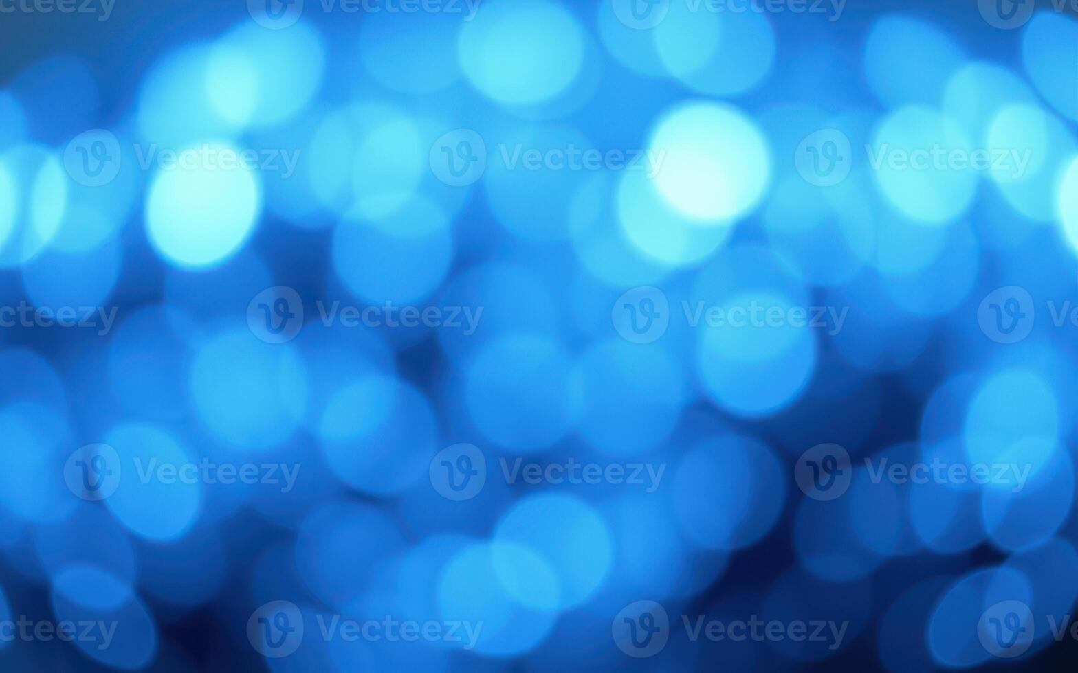 Vibrant blue bokeh lights create a dreamy atmosphere during an evening celebration in a lively urban setting photo