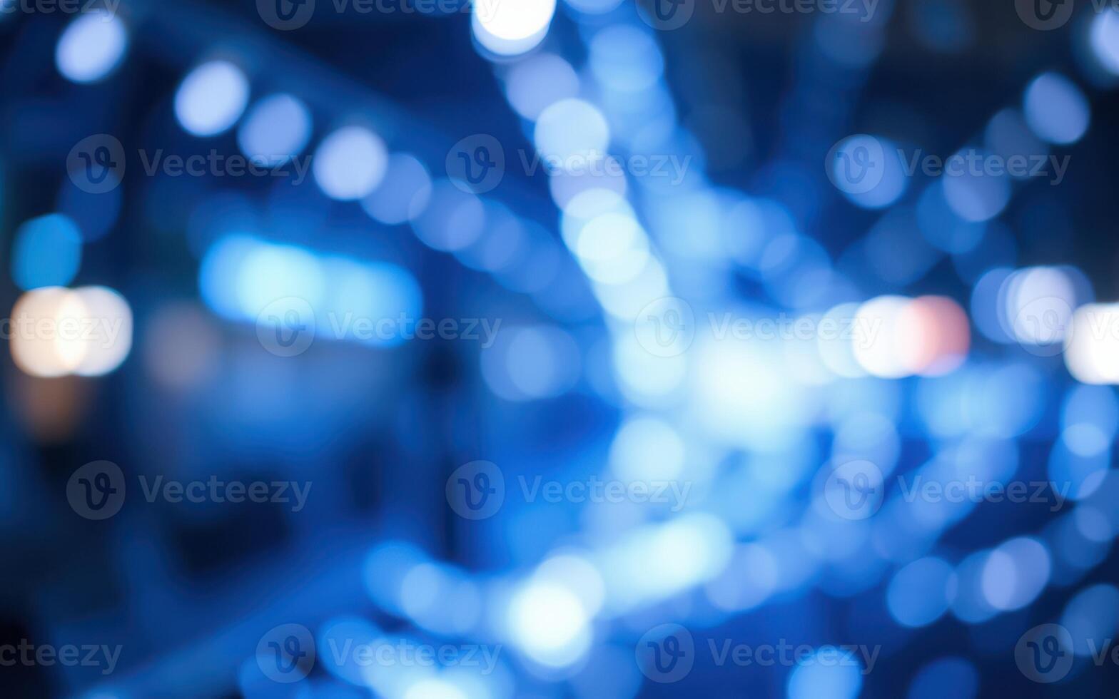 Vibrant blue lights create a mesmerizing abstract effect in a dimly lit urban environment photo