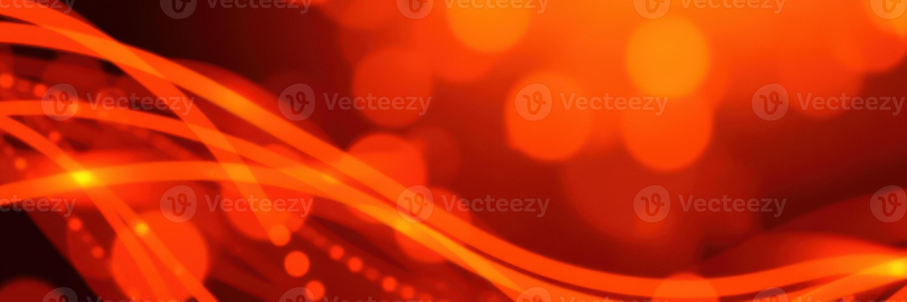 Vibrant abstract background with flowing lines and warm bokeh lights in shades of orange photo