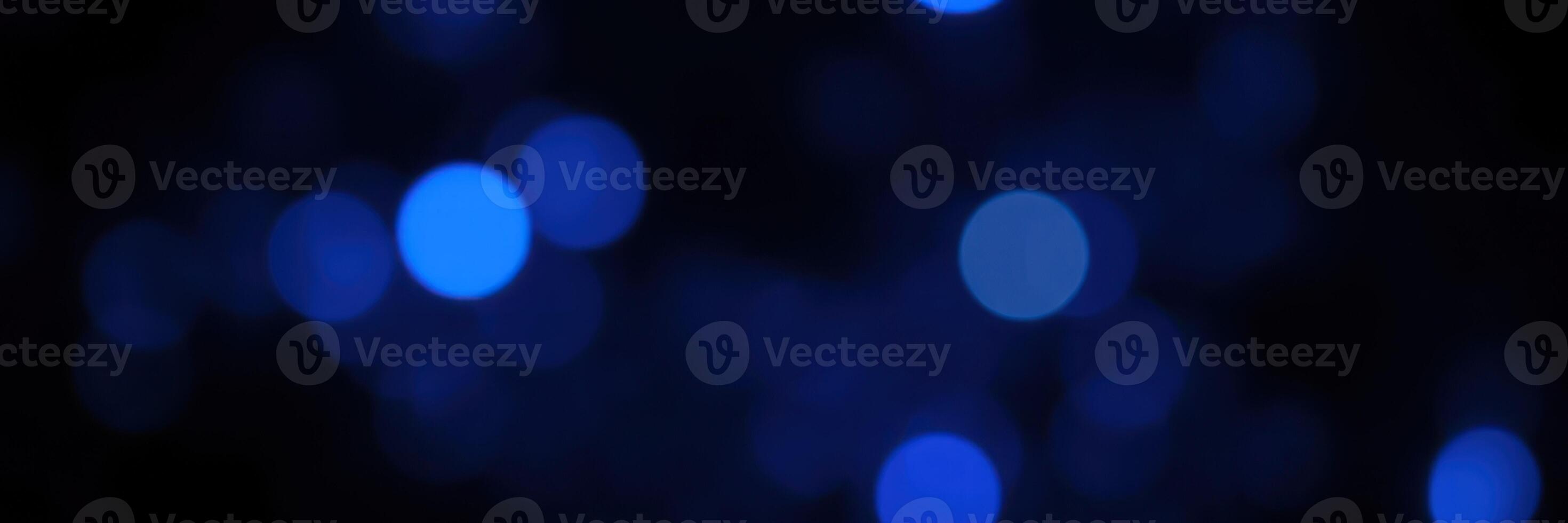 Beautiful blue bokeh lights create a dreamy atmosphere during a festive evening celebration photo