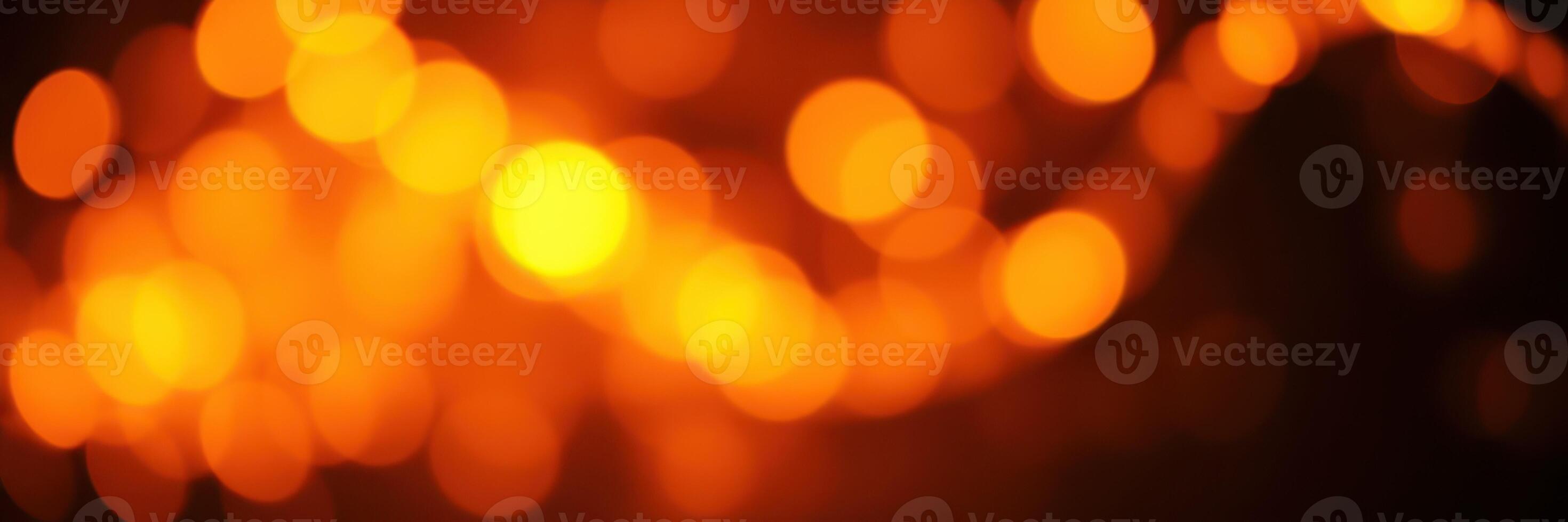 Warm orange bokeh lights create a cozy atmosphere for evening gatherings during autumn festivities photo