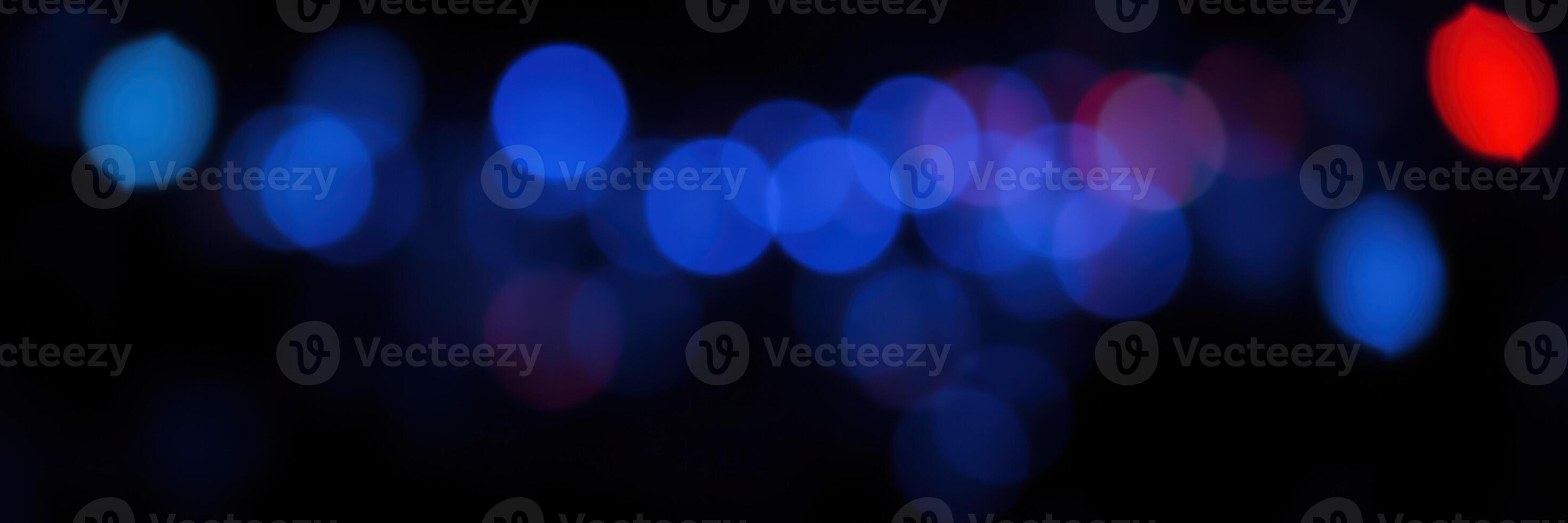 Colorful bokeh lights create an abstract display at a festive nighttime event in the city photo