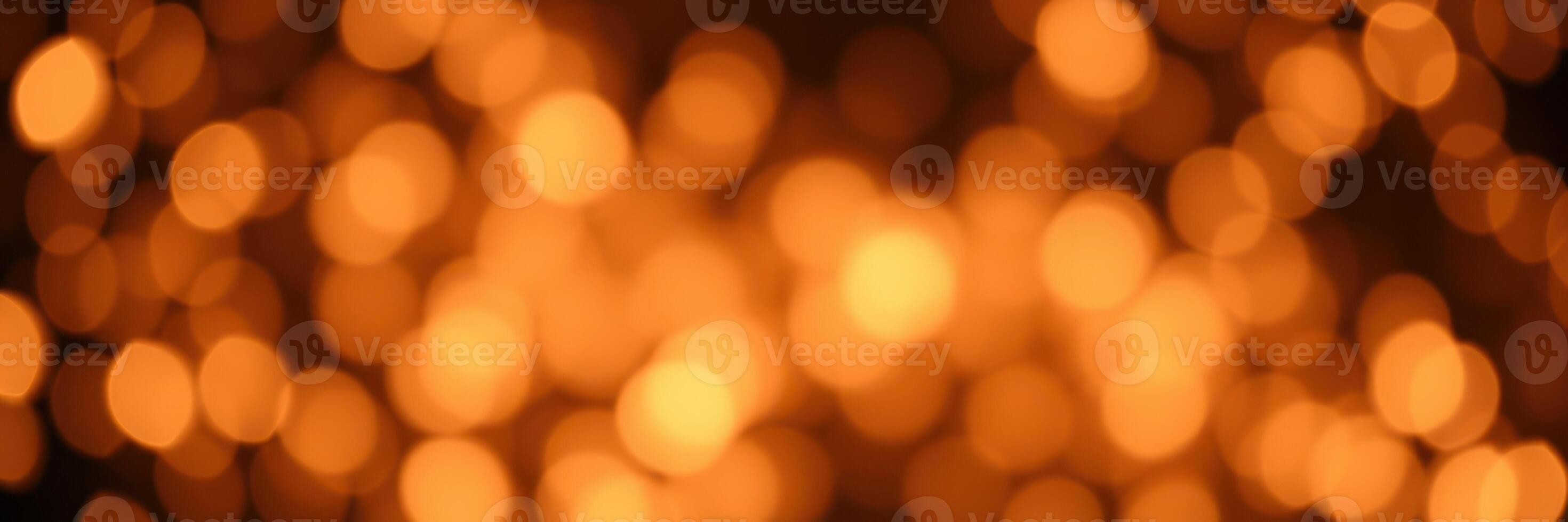 Bright orange bokeh lights create a warm atmosphere during a festive celebration at night photo