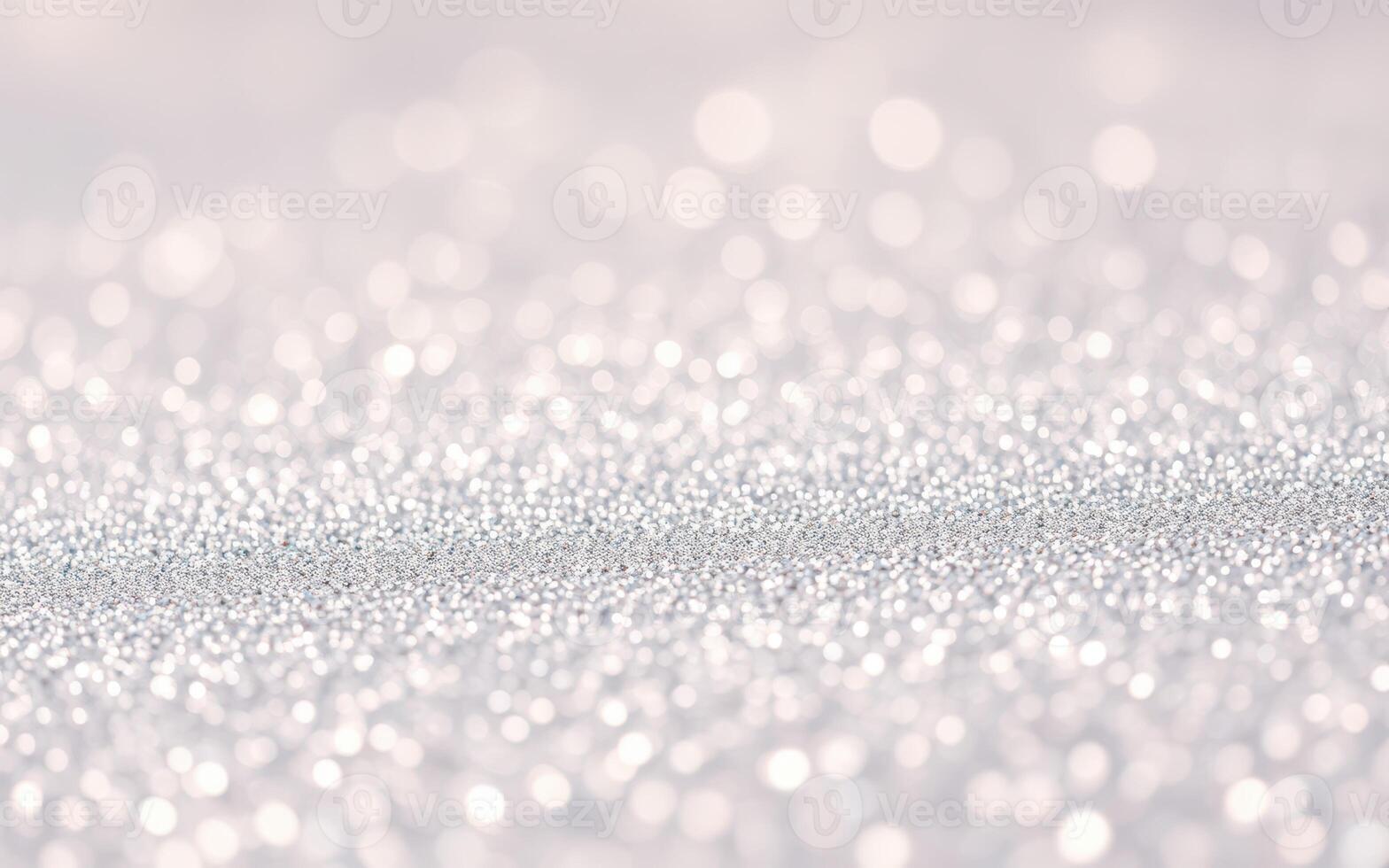 Glimmering silver particles create a dreamy and ethereal atmosphere in a softly lit setting photo
