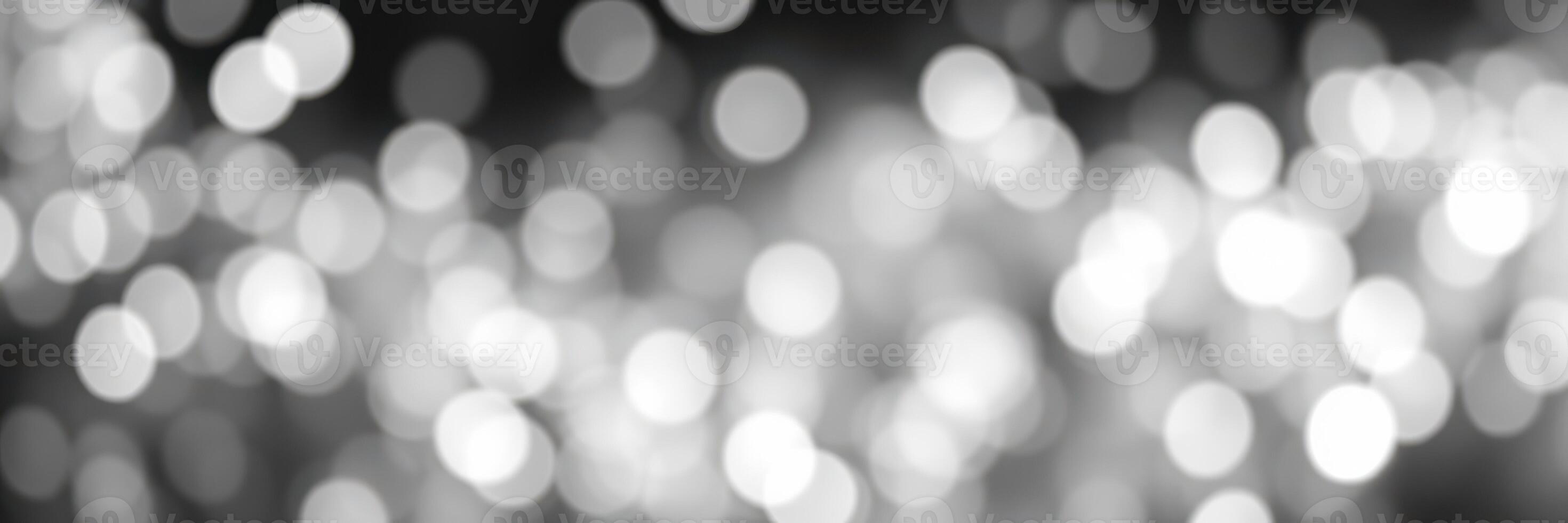 Sparkling bokeh lights create a dreamy atmosphere at a festive evening gathering photo
