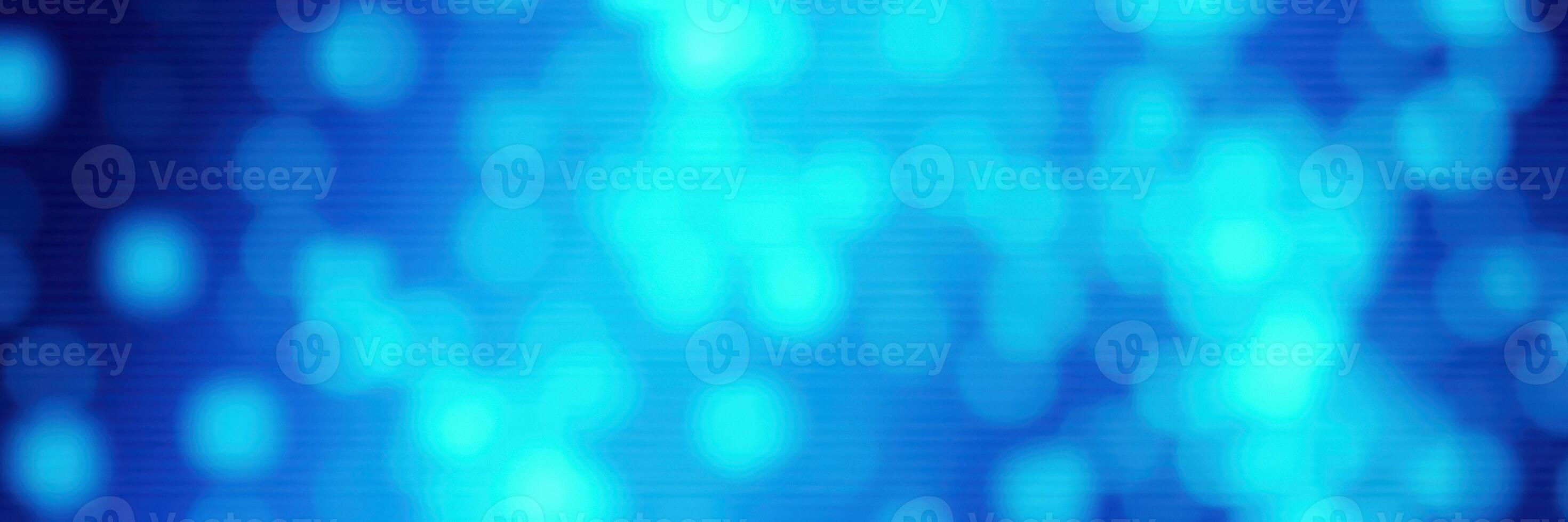 Soft blue bokeh lights create a dreamy atmosphere in this artistic depiction of shimmering colors photo