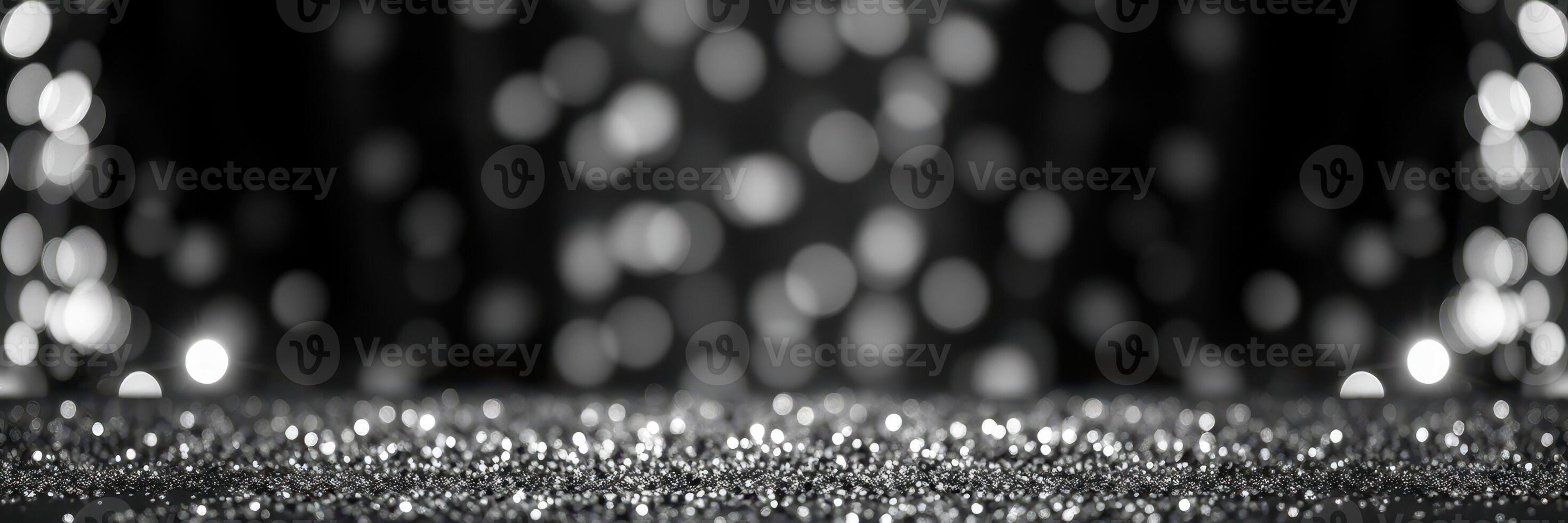 Sparkling bokeh background creates a glamorous atmosphere for celebrations or events in black and white photo