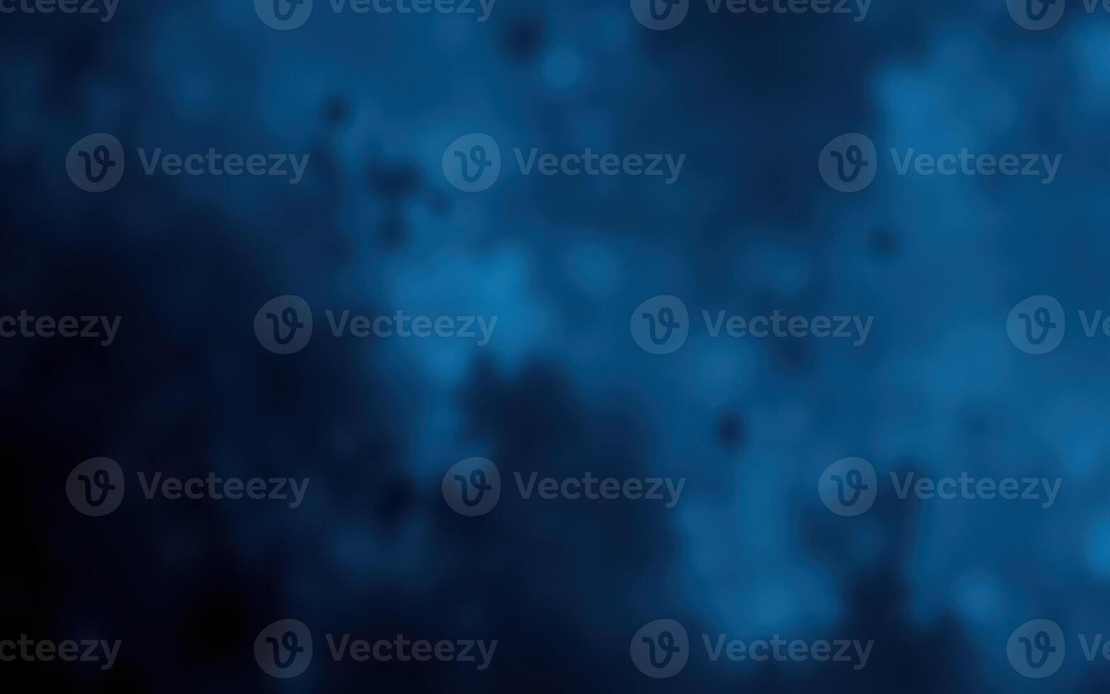 Vibrant blue abstract background with misty texture creating a sense of depth and calmness for artistic purposes photo