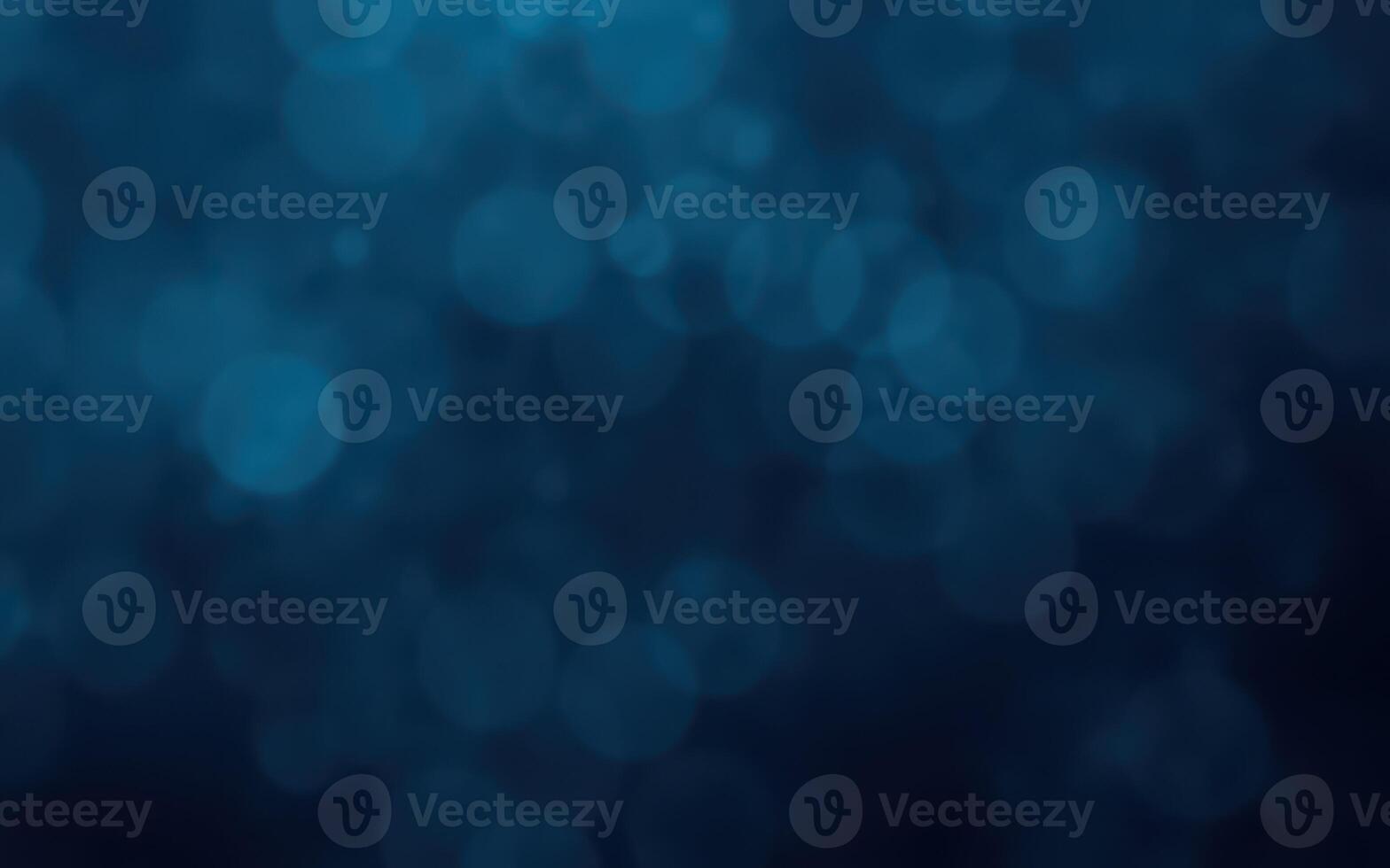 Abstract blue bokeh background creates a serene and calming effect suitable for various design projects photo