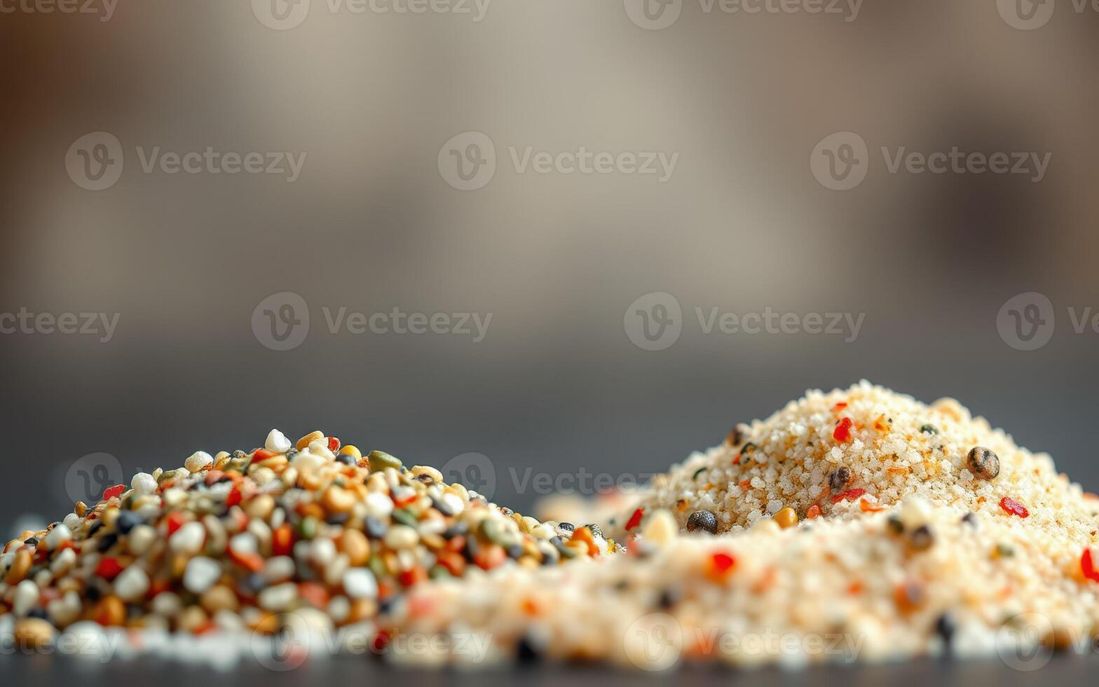 Different types of spices and seasonings displayed on a wooden surface in a kitchen setting photo