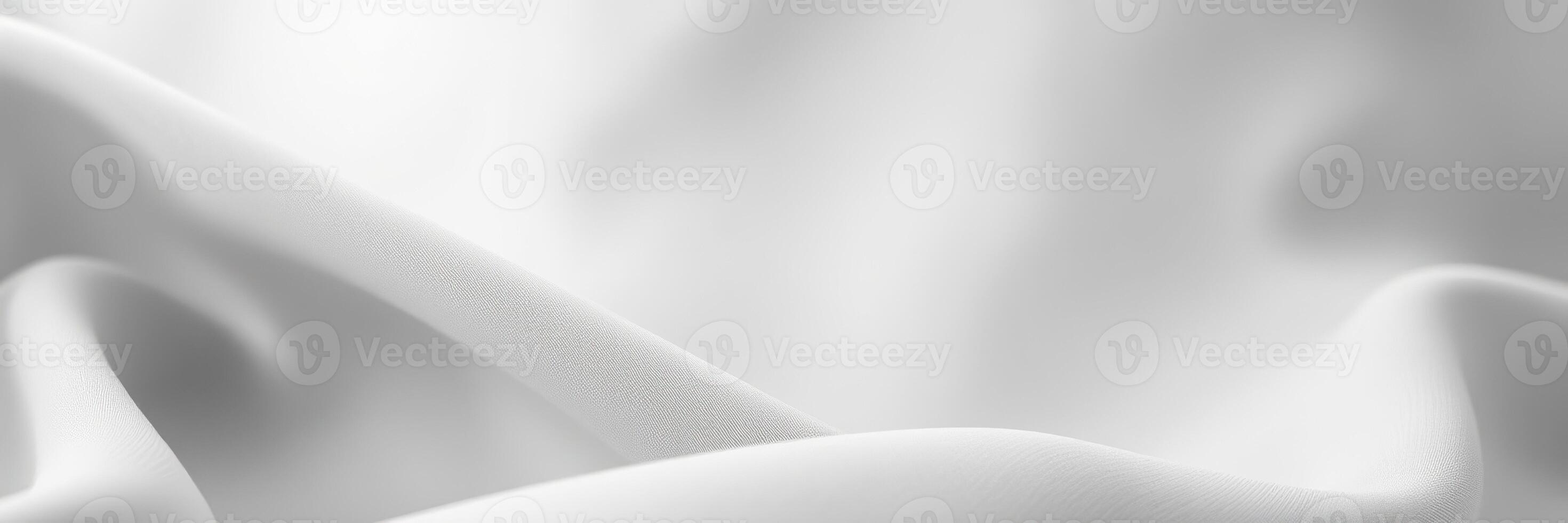 Soft white fabric draping elegantly under natural light in a serene setting photo