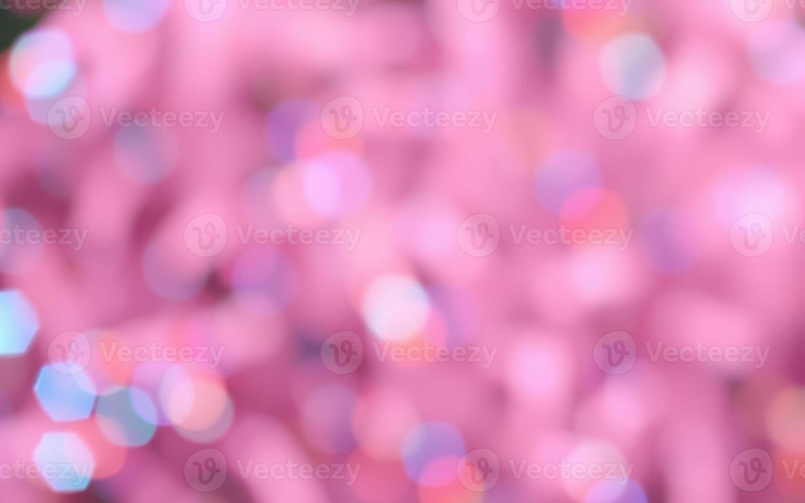 Colorful abstract background featuring vibrant pink hues and sparkling light reflections during a festive celebration photo