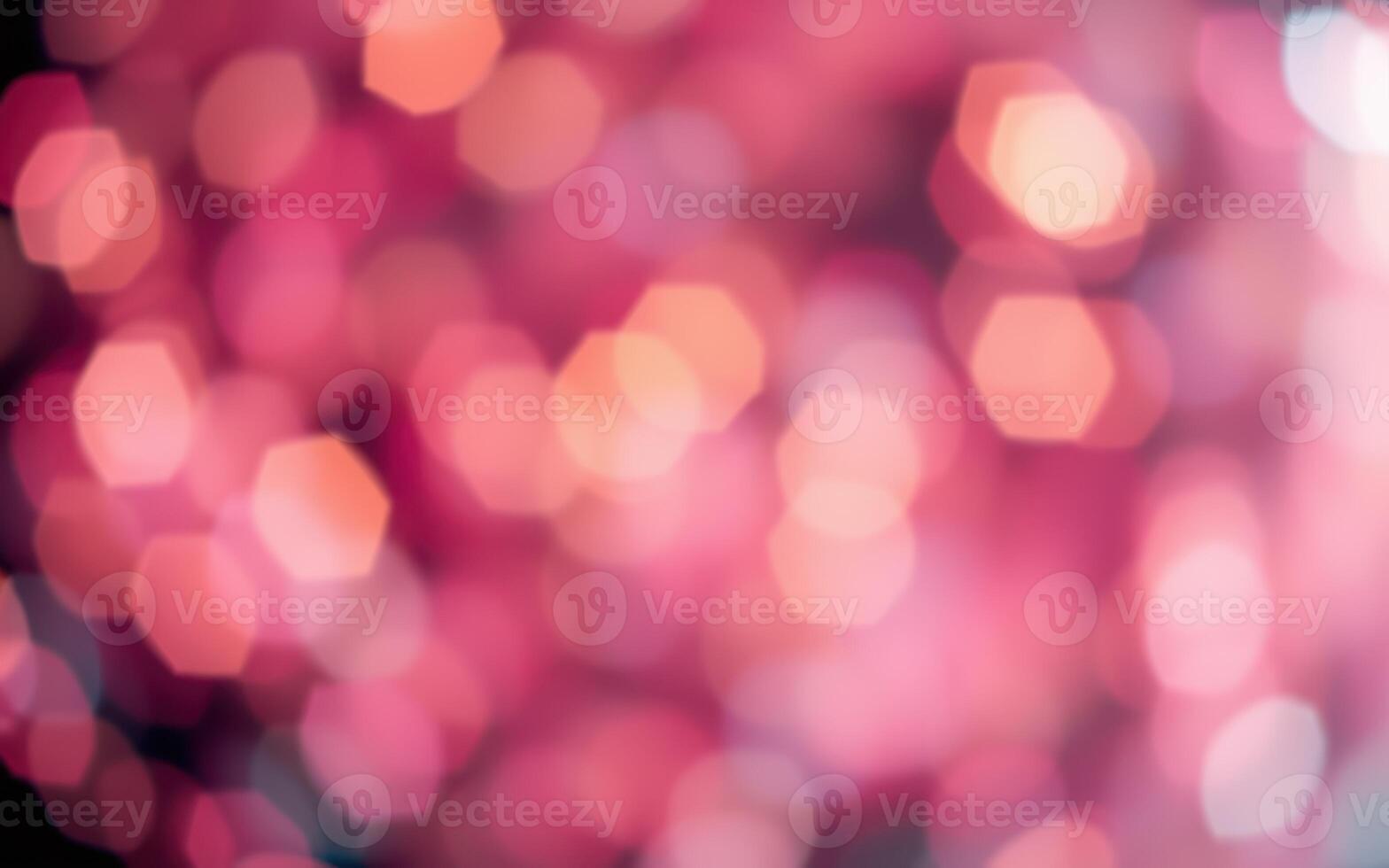 Vibrant pink bokeh lights create a dreamy atmosphere at an evening celebration photo