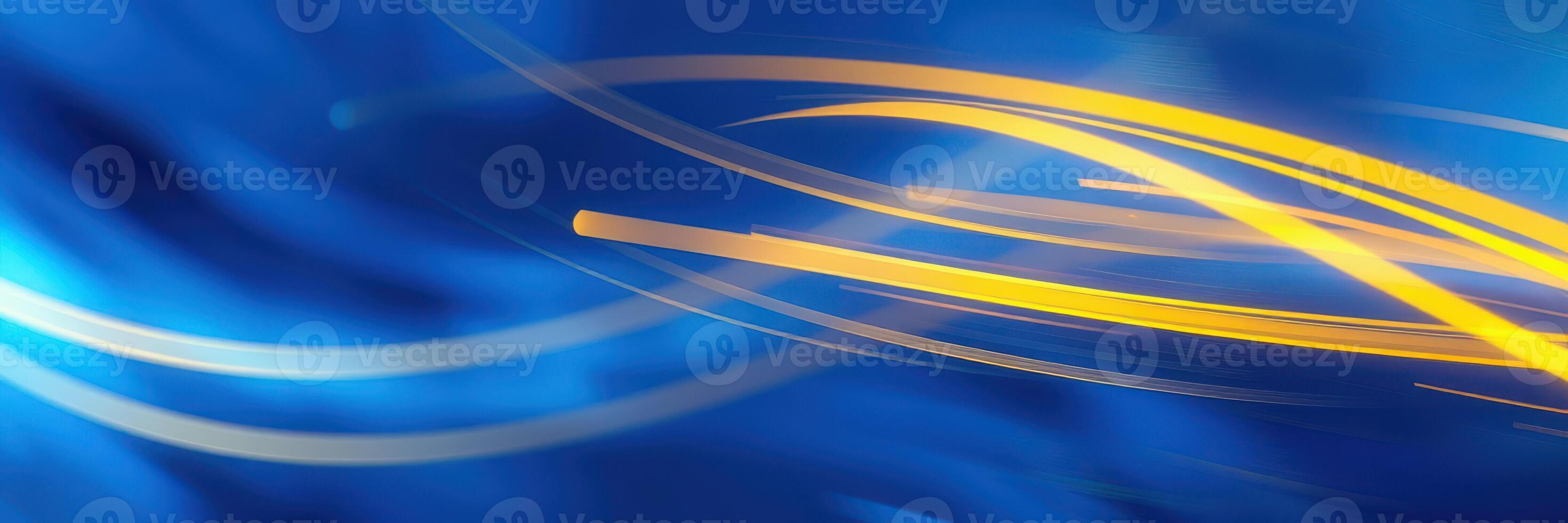 Colorful streaks of blue and yellow light swirl together in a dynamic abstract composition photo