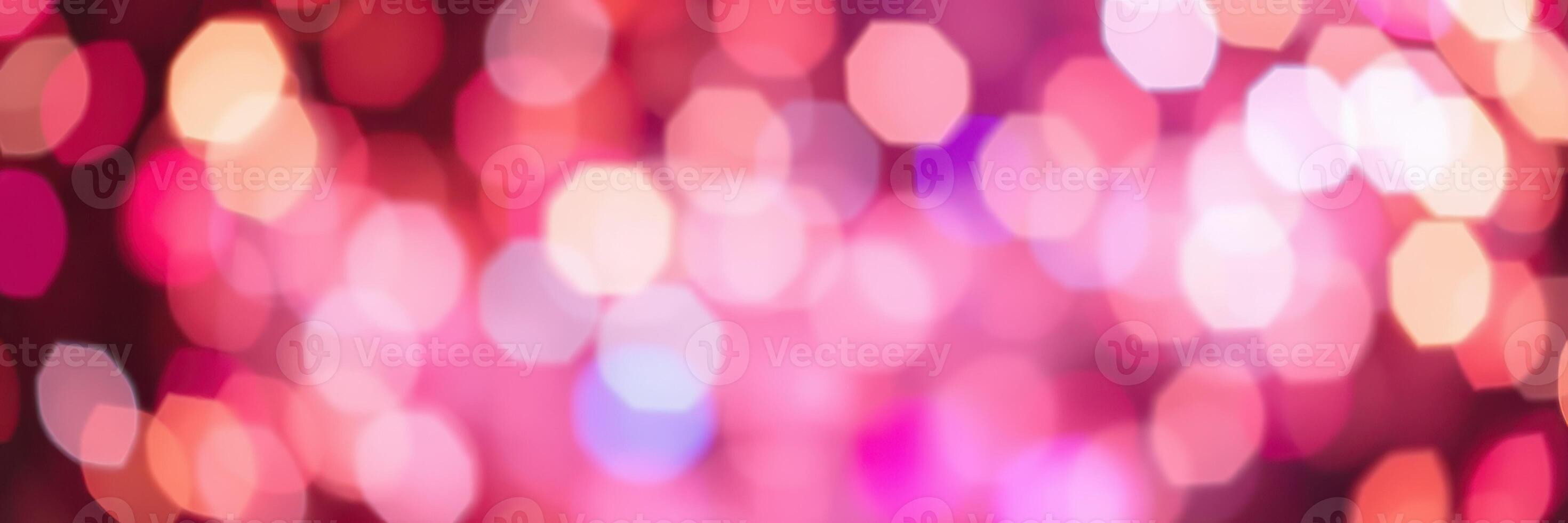 Colorful and vibrant bokeh lights create a festive atmosphere during a nighttime celebration event photo