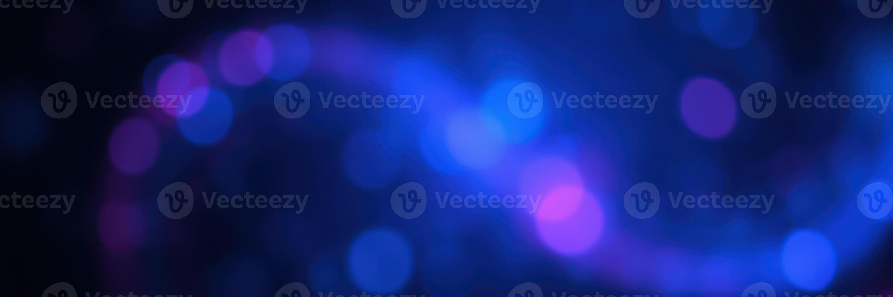 Colorful abstract swirl with blue and purple bokeh lights creating a dreamy atmosphere in an artistic setting photo