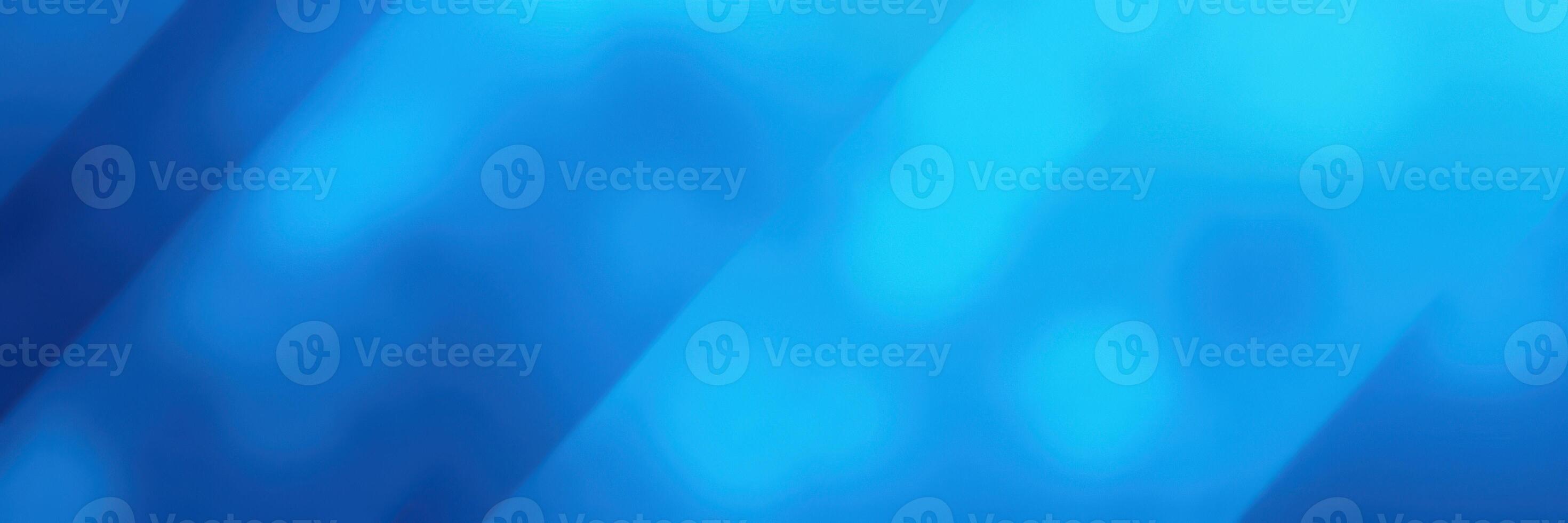 Vibrant blue abstract background with dynamic light patterns creating a sense of depth and motion photo