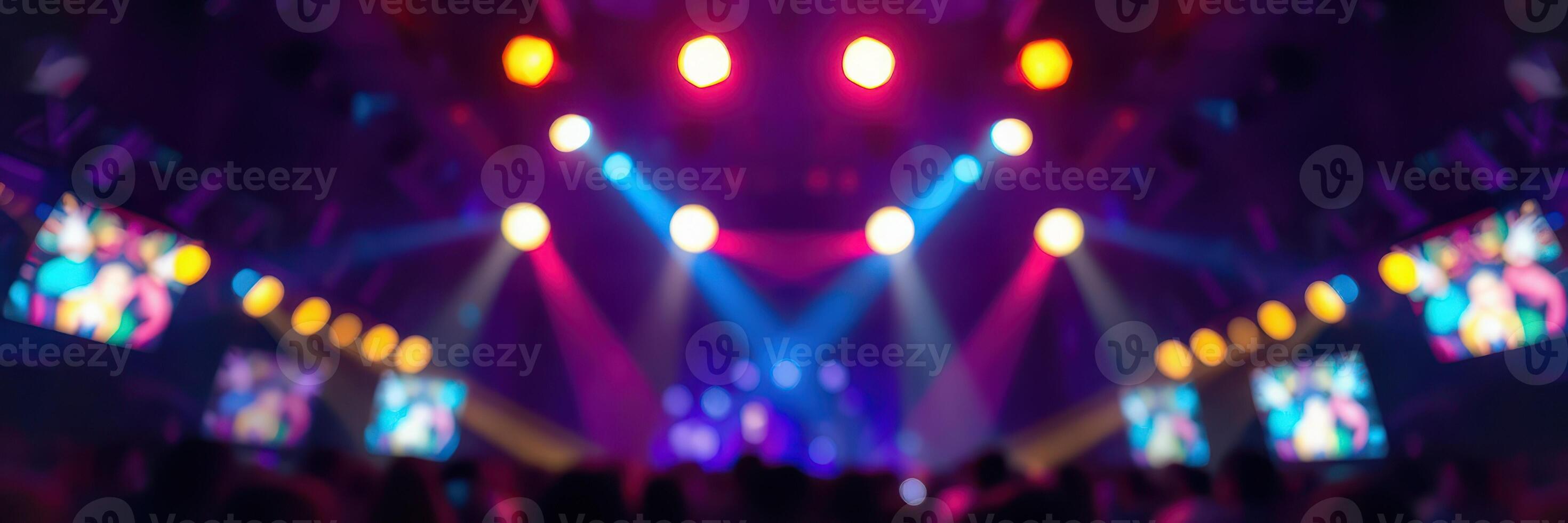 Vibrant concert atmosphere with colorful lights and energetic crowd enjoying live music photo