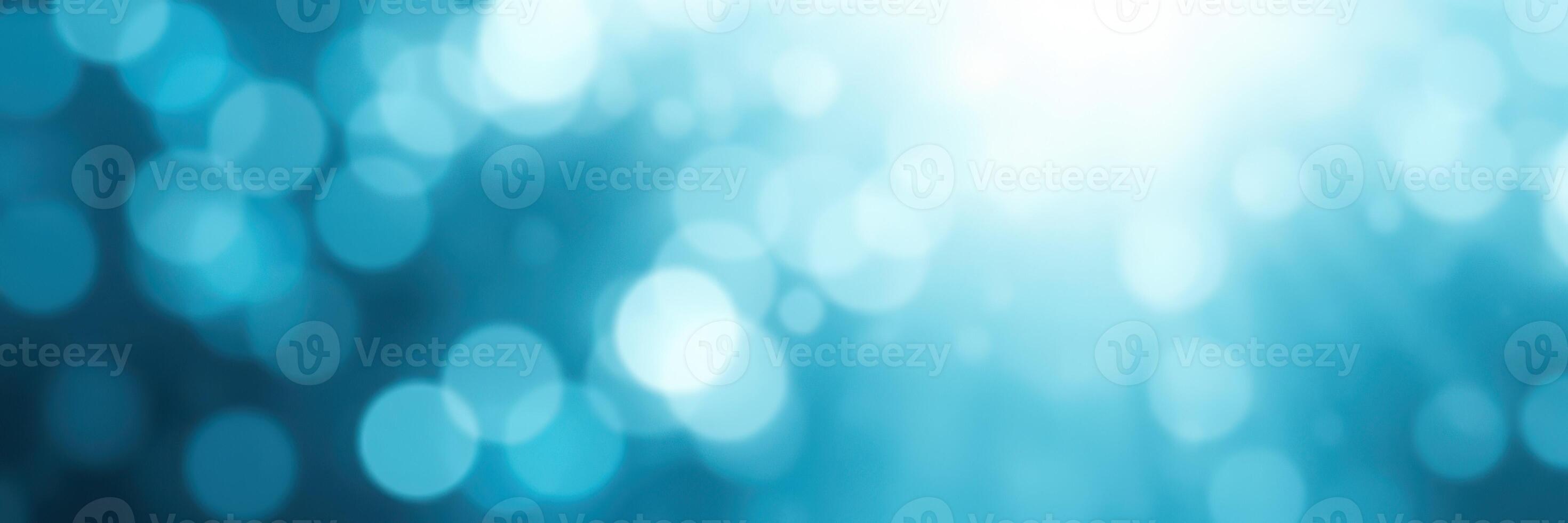 Soft blue bokeh background creates a calming atmosphere for creative projects and presentations photo