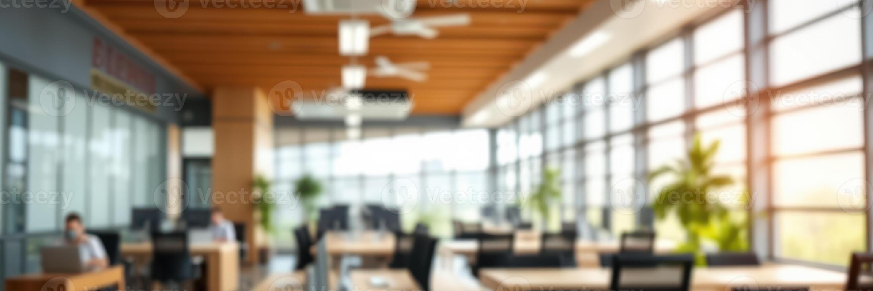 Modern office environment with large windows and natural light during daytime hours showcasing a productive workspace photo