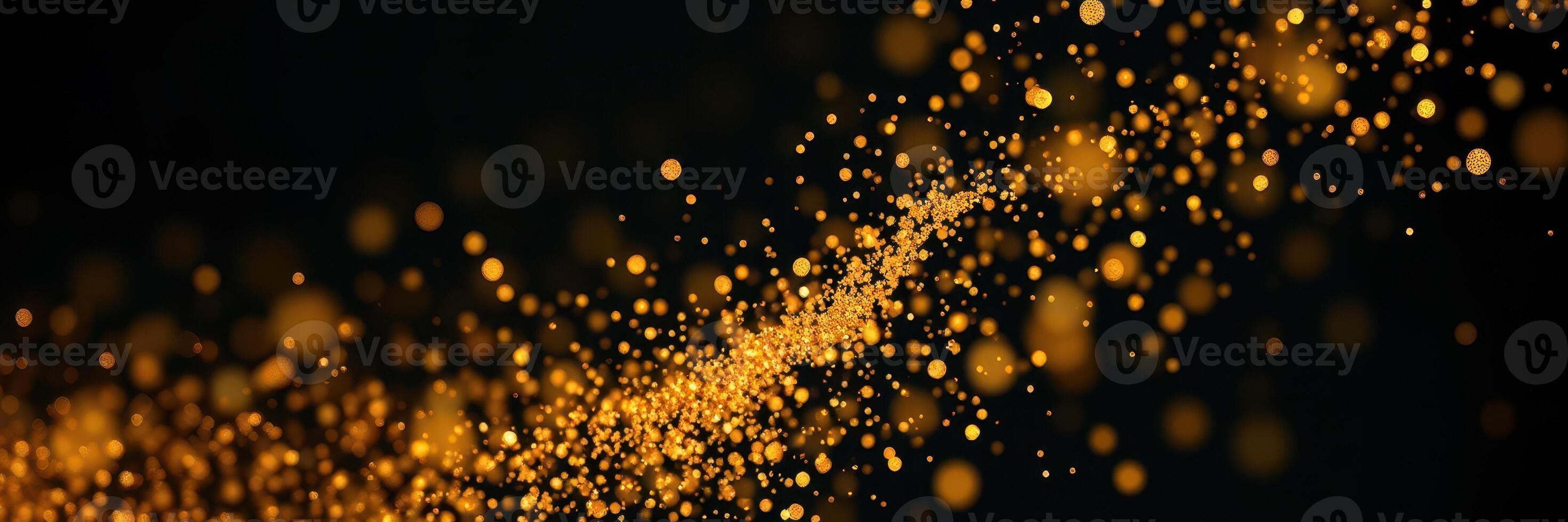 Golden particles shimmer in a dark background creating a magical effect during a celebratory event photo