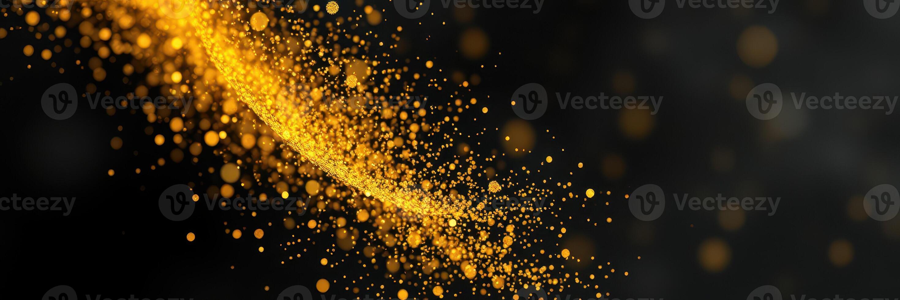 Shimmering golden particles swirling through a dark background creating a magical effect photo