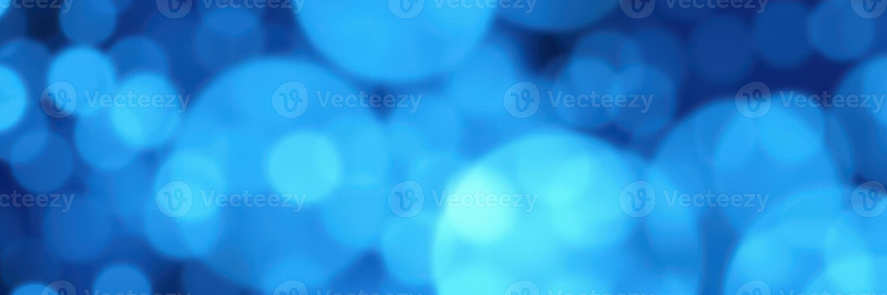 Beautiful blue bokeh background created by soft lights in an artistic abstract style for creative projects photo