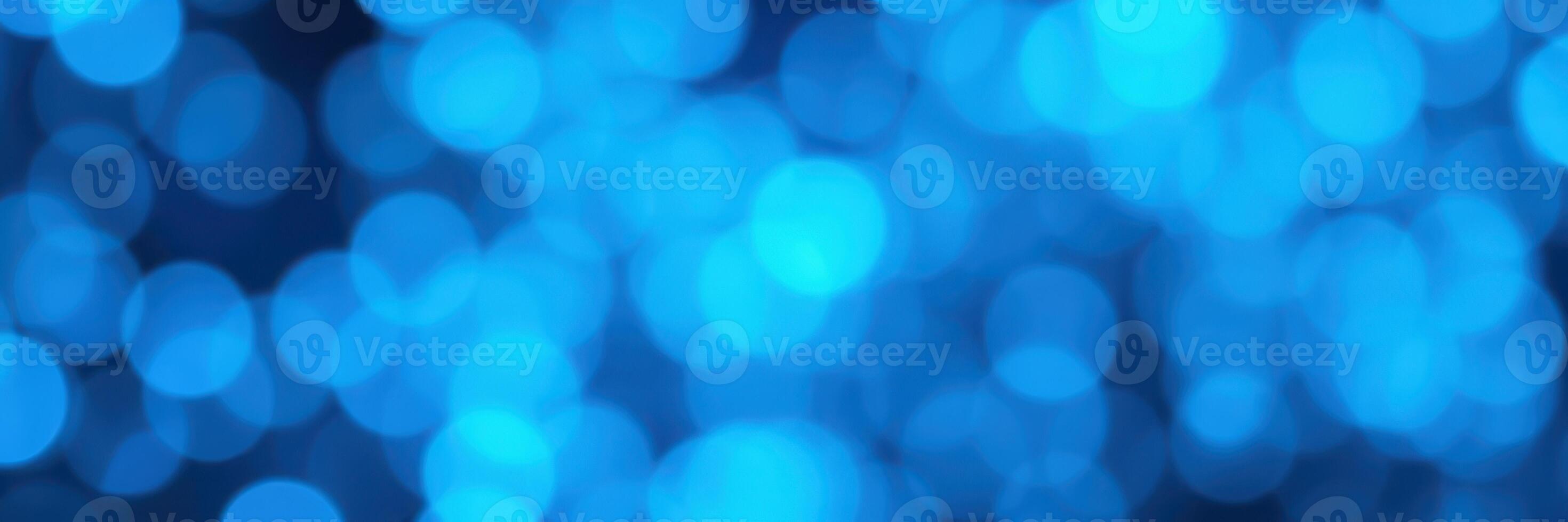 Captivating blue bokeh lights create a vibrant atmosphere for a lively celebration at night photo