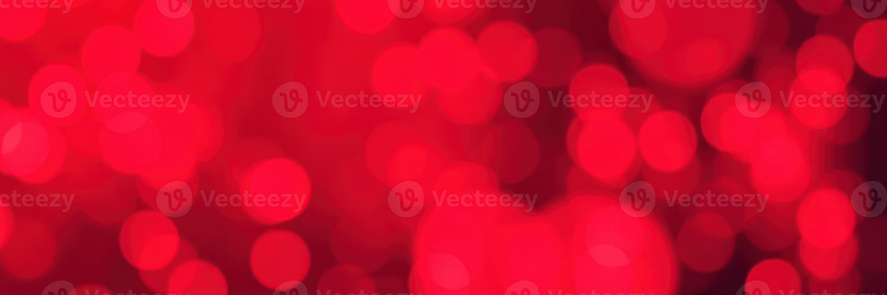 Vibrant red abstract background with blurred lights creating a festive atmosphere photo
