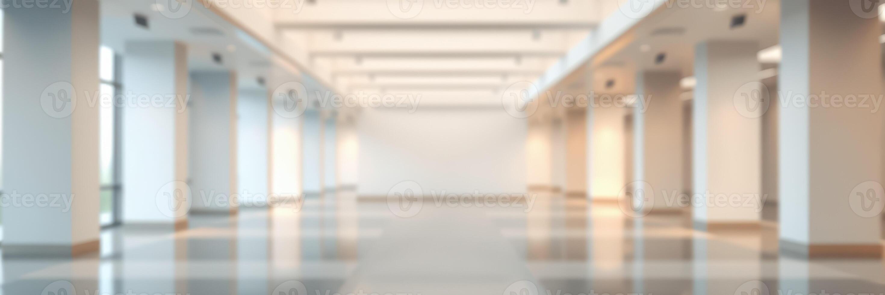 Spacious interior hallway features bright lighting and polished floors in a modern building photo