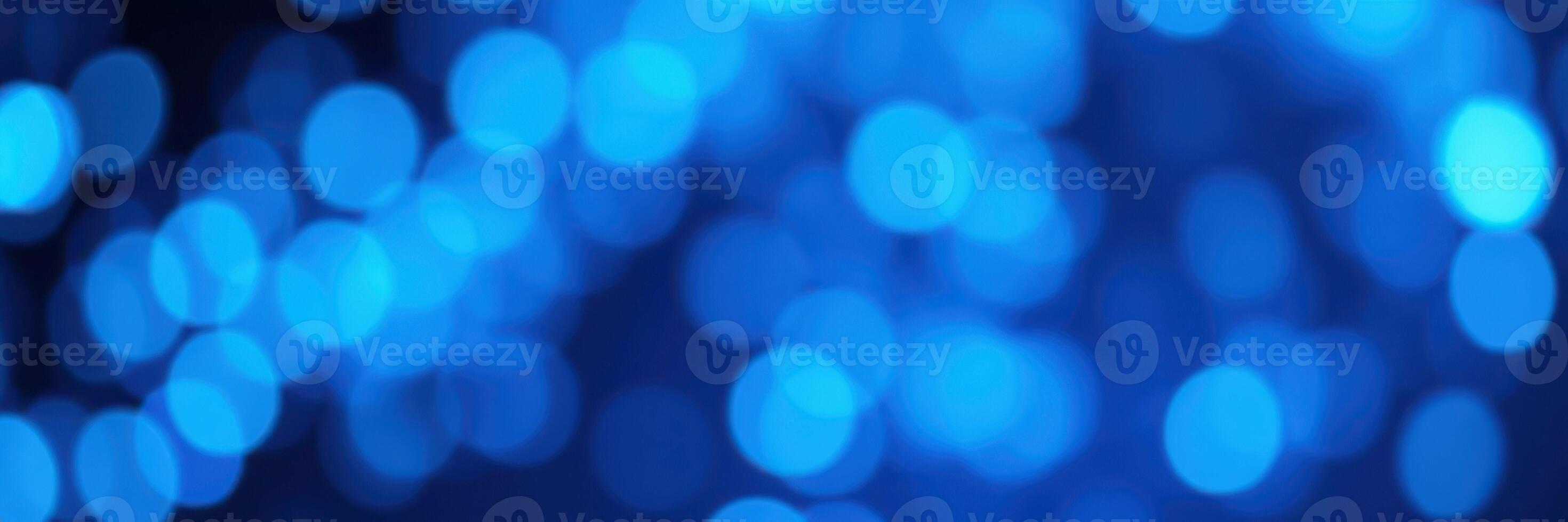Soft blue bokeh lights create a calming atmosphere during a serene evening gathering in a cozy outdoor setting photo