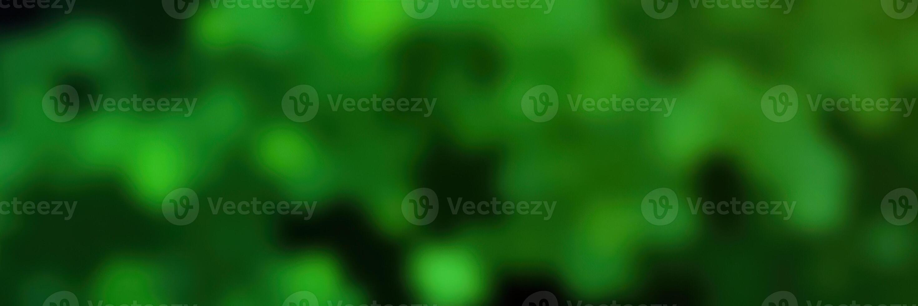 Vibrant green bokeh effect created by light patterns in nature during a sunny day in a peaceful outdoor setting photo