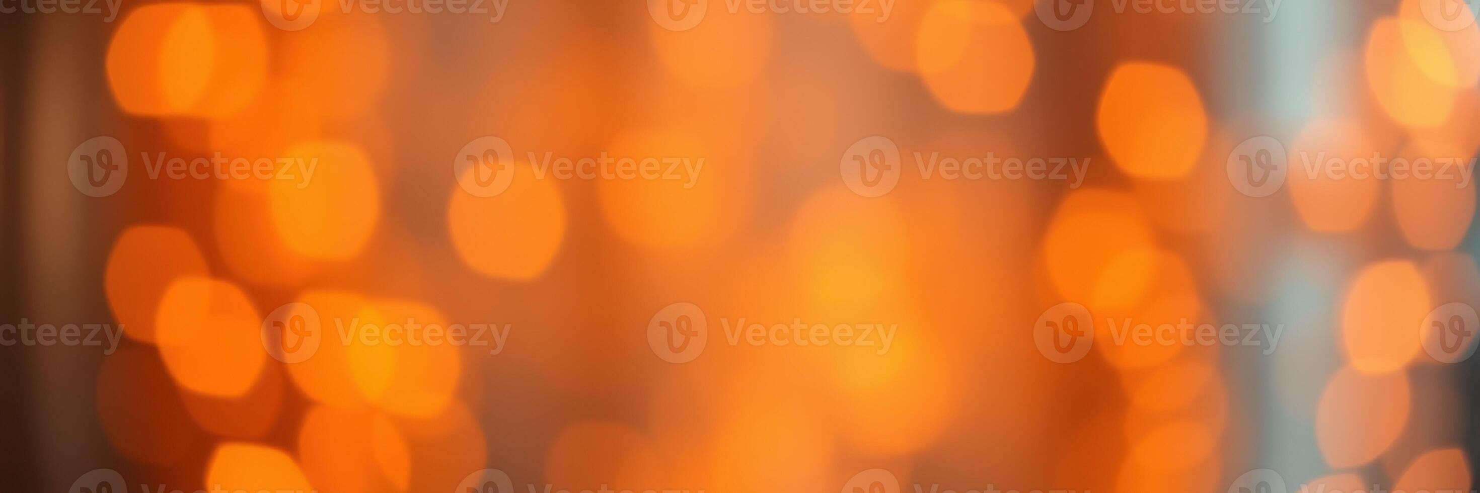 Warm orange bokeh lights create a cozy atmosphere in a festive setting during evening hours photo