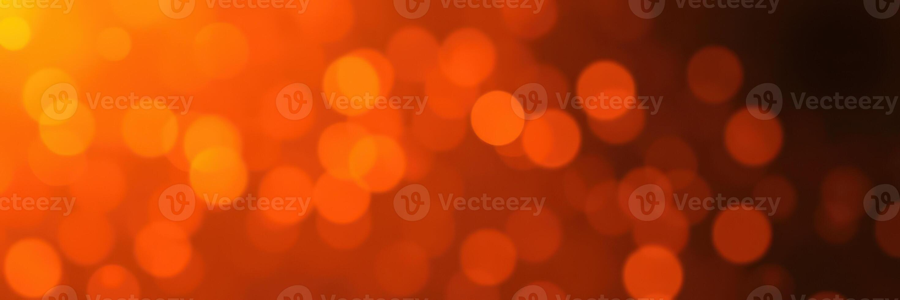 Warm and vibrant bokeh background created by shimmering lights in soft focus at night photo