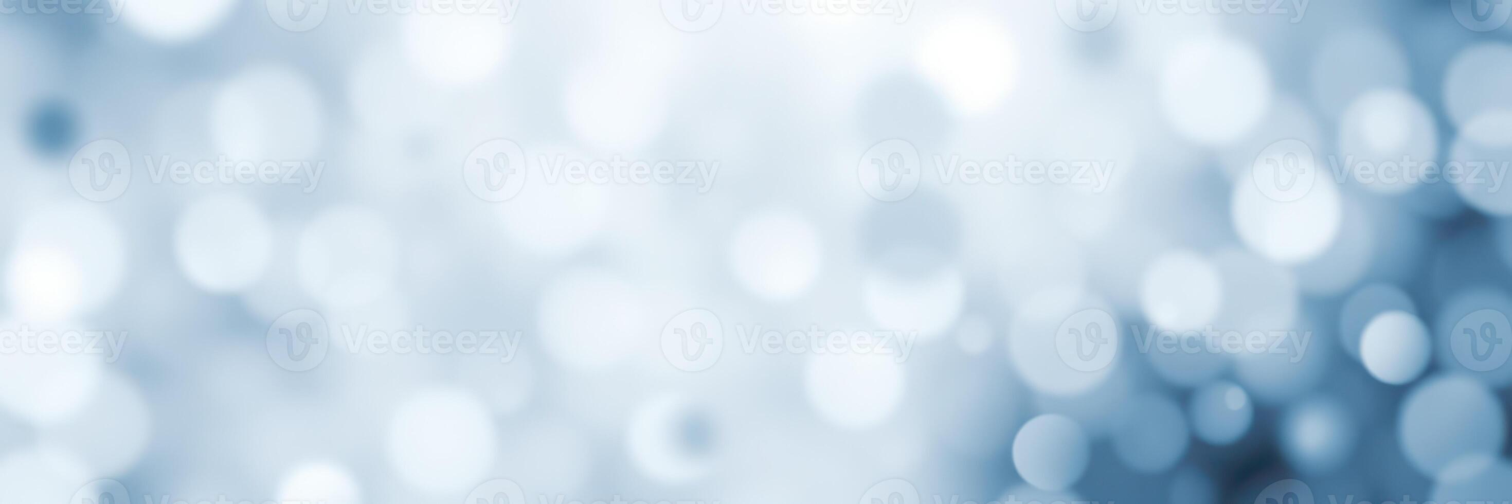 Soft blue bokeh lights create an ethereal atmosphere for a festive celebration or serene setting photo