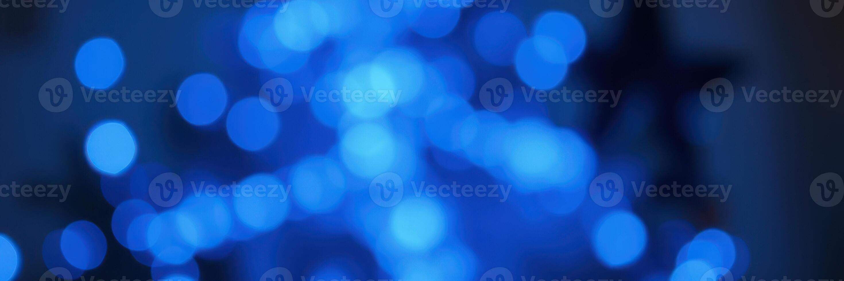 Soft blue bokeh lights create a calming atmosphere in a cozy indoor setting during the evening photo