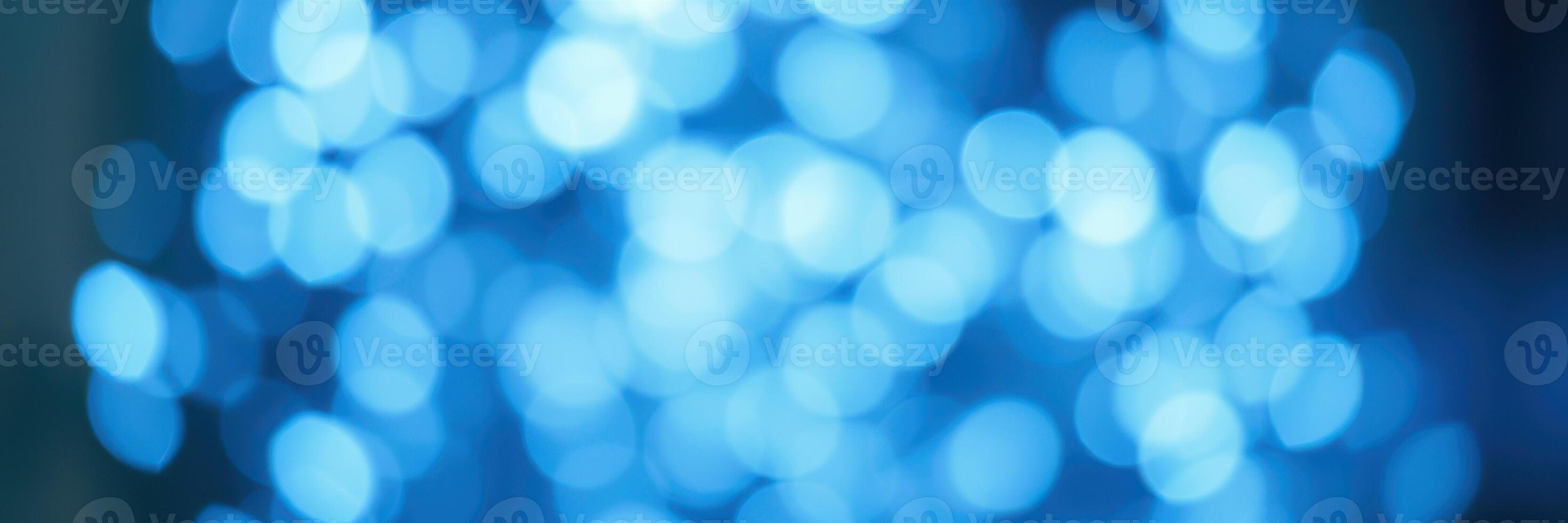 Glowing blue bokeh lights create a tranquil atmosphere for evening events and celebrations photo