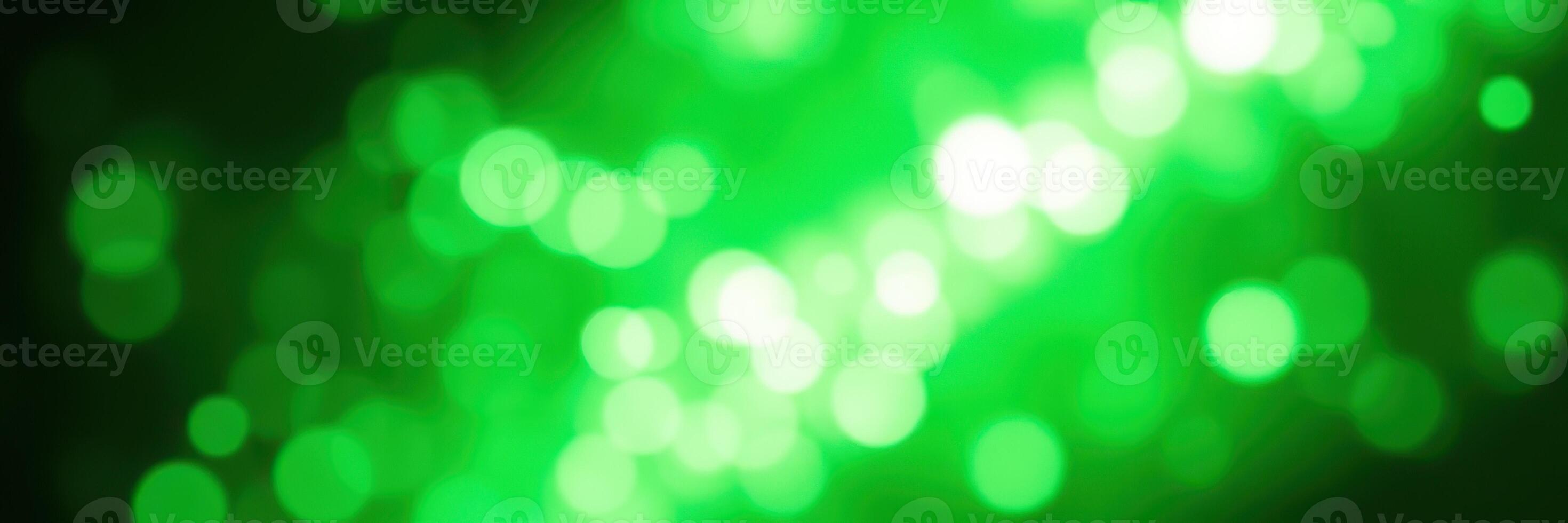 Lively green bokeh lights creating a festive atmosphere during an evening event or celebration photo