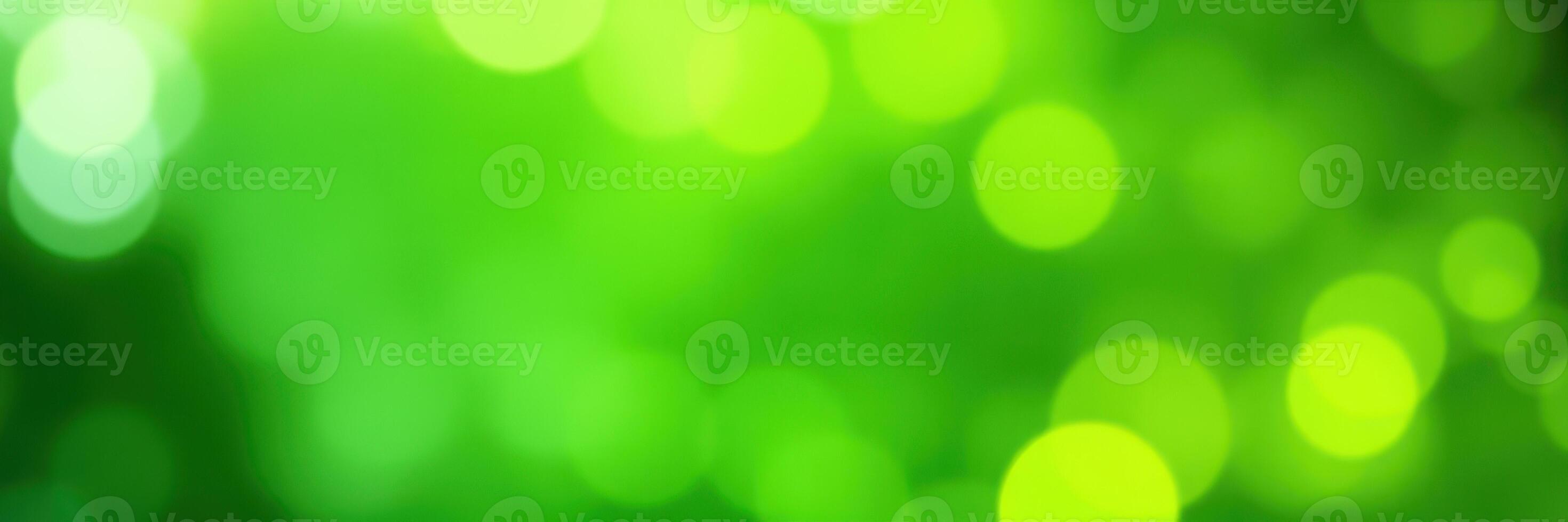 Abstract green bokeh background creating a vibrant atmosphere of nature and light during a sunny day photo