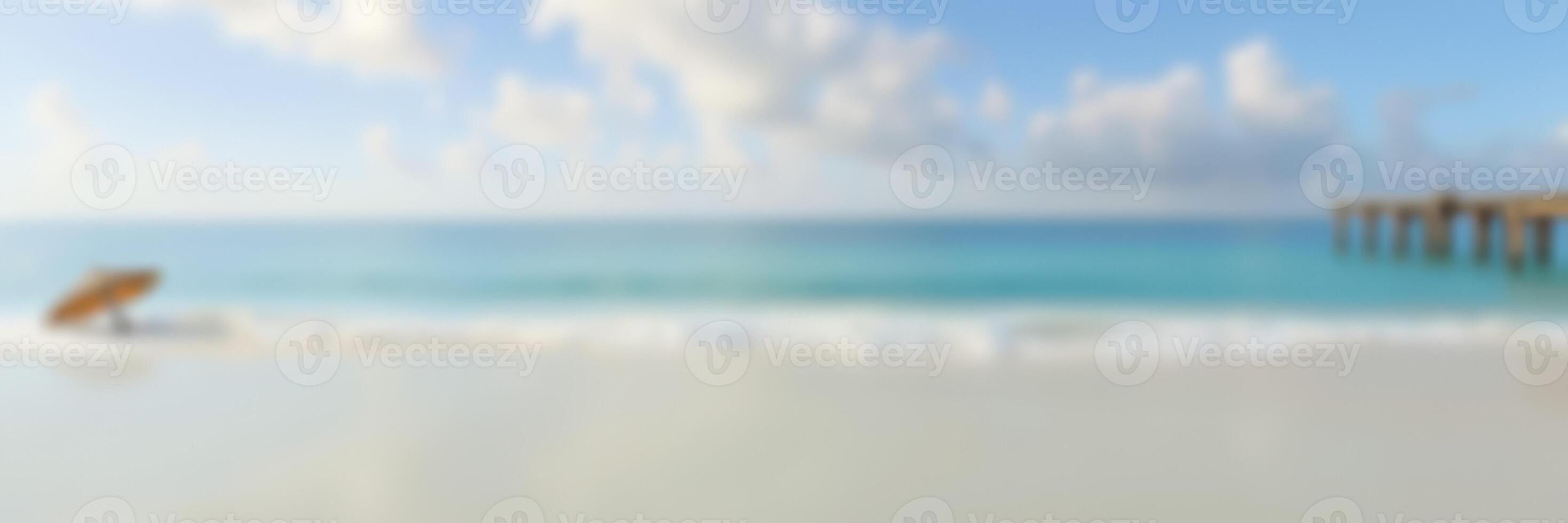 Relaxing beach scene on a sunny day with gentle waves and a clear blue sky photo
