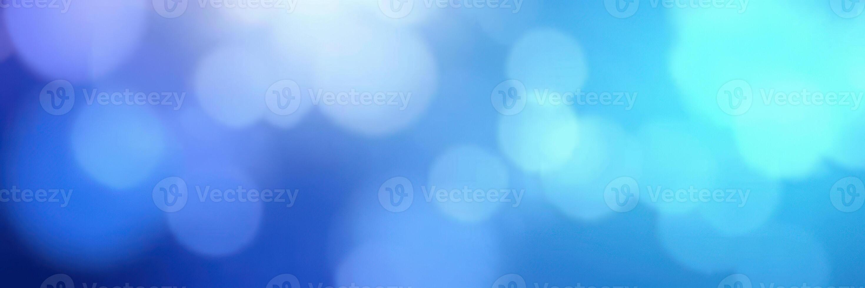 Soft blue and purple bokeh lights create an ethereal atmosphere for creative backgrounds and designs photo